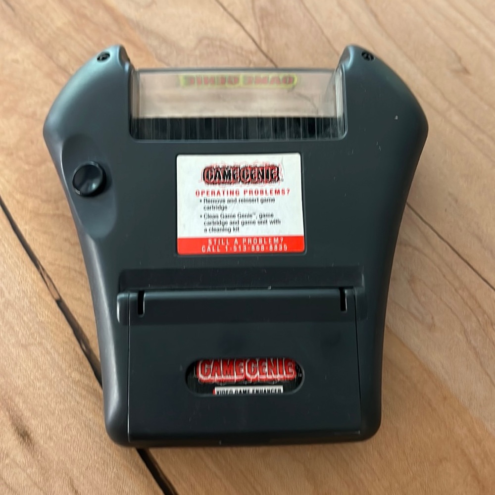 Sega Game Genie for Game Gear with book. 1993